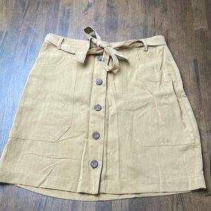 Tan mini skirt with button front and tie belt